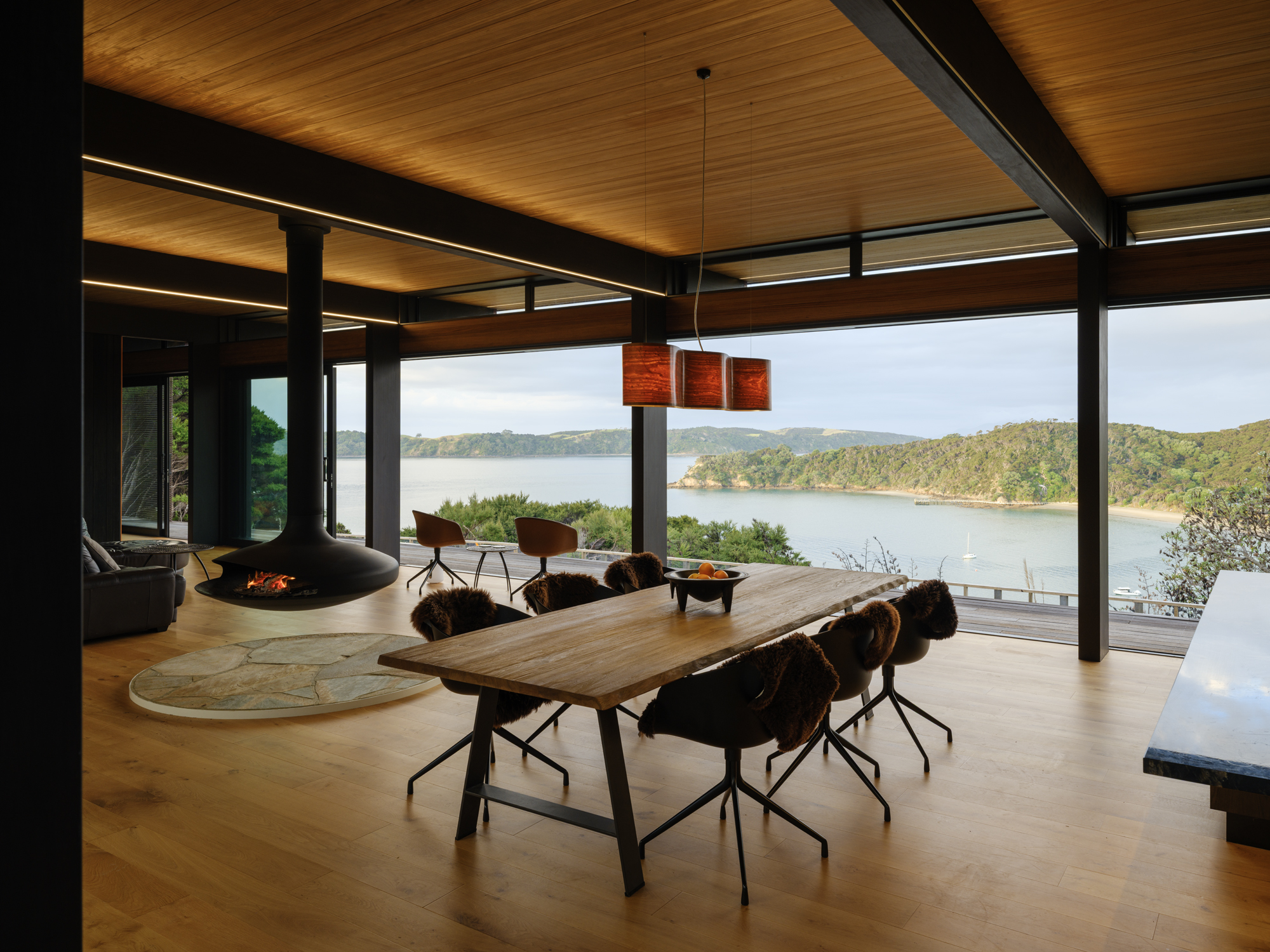The architectural lighting was supplied by Moth Light on this award-winning home on Kawau Island.